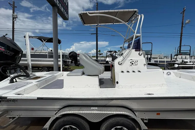 Slide: The Image of 2023 Shoalwater 23 Catamaran on trailer, featuring sleek design and modern equipment. - 15