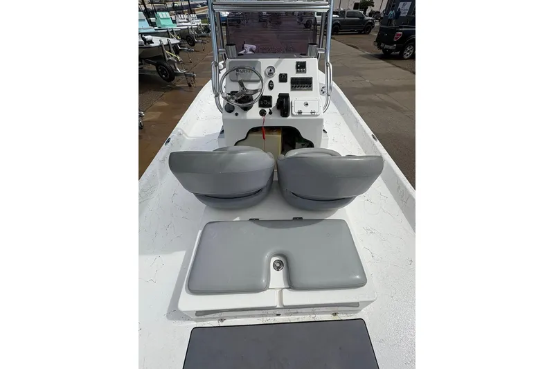 Slide: The Image of 2023 Shoalwater 23 Catamaran boat interior with steering console and seating. - 8