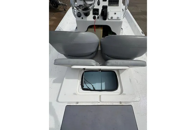 Slide: The Image of 2023 Shoalwater 23 Catamaran interior with seating and storage compartment. - 9