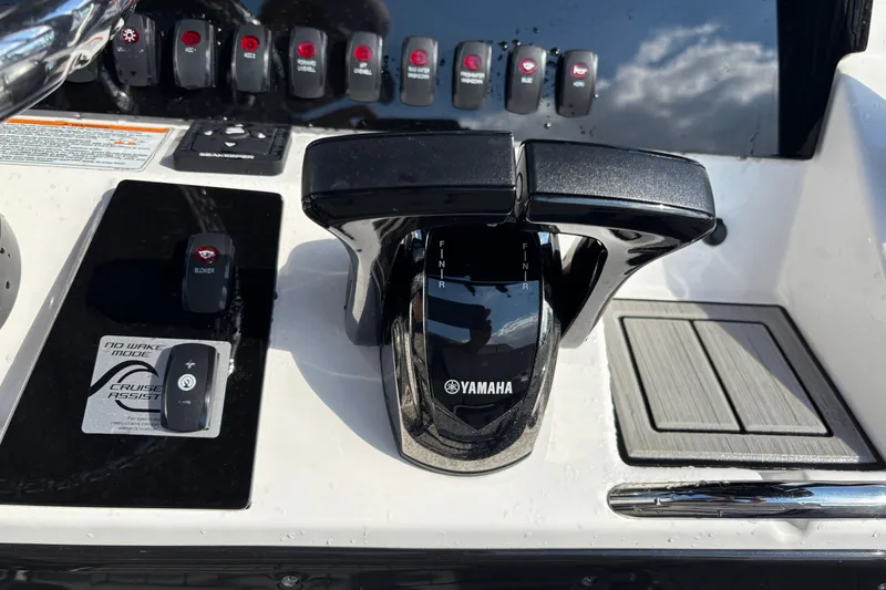 Slide: The Image of Yamaha Boats 2021 255 FSH Sport E control panel with throttle and switches. - 17
