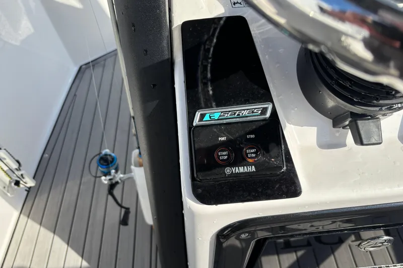 Slide: The Image of 2021 Yamaha Boats 255 FSH Sport E control panel with start/stop buttons. - 21