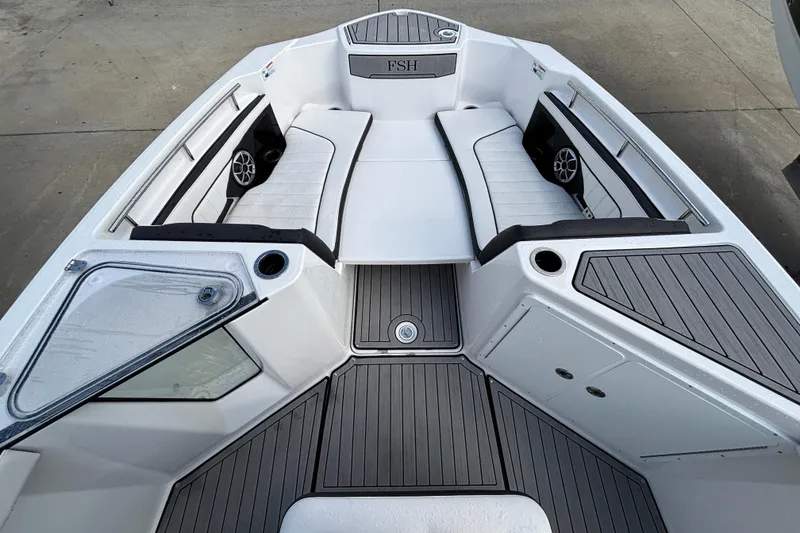 Slide: The Image of 2021 Yamaha Boats 255 FSH Sport E interior with seating and storage compartments. - 22