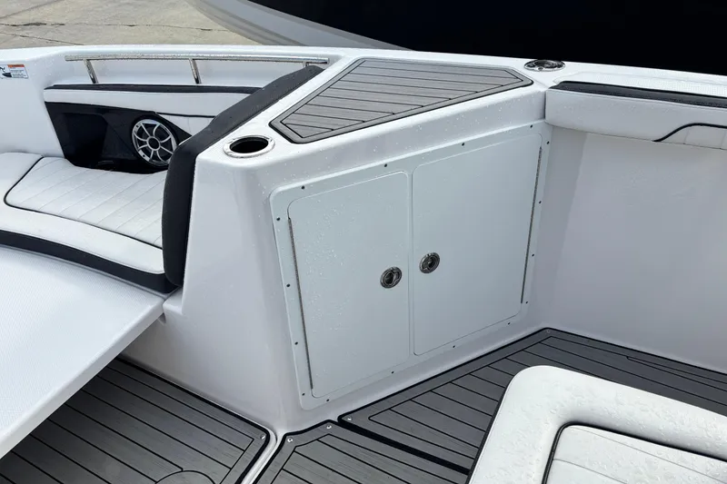 Slide: The Image of 2021 Yamaha Boats 255 FSH Sport E interior with seating and storage compartments. - 25