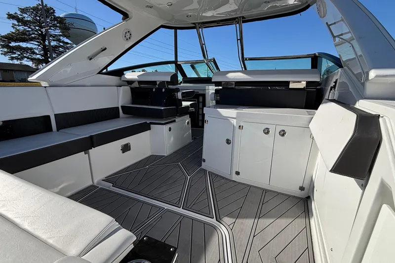 Slide: The Image of 2023 Monterey 385SS Super Sport boat interior with sleek seating and modern design. - 10