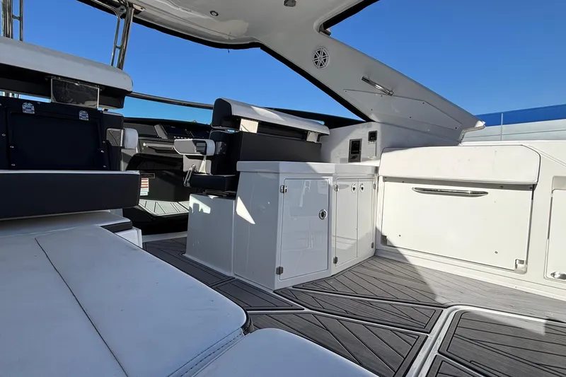 Slide: The Image of 2023 Monterey 385SS Super Sport boat interior with sleek seating and modern design. - 13