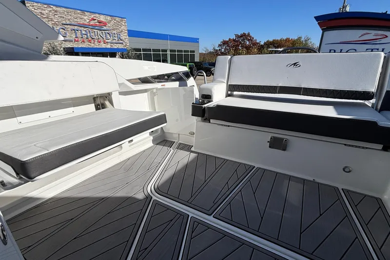 Slide: The Image of 2023 Monterey 385SS Super Sport boat interior with sleek seating and modern flooring. - 15