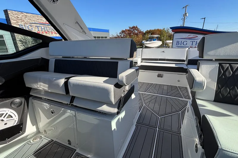 Slide: The Image of 2023 Monterey 385SS Super Sport boat interior with modern seating and sleek design. - 16