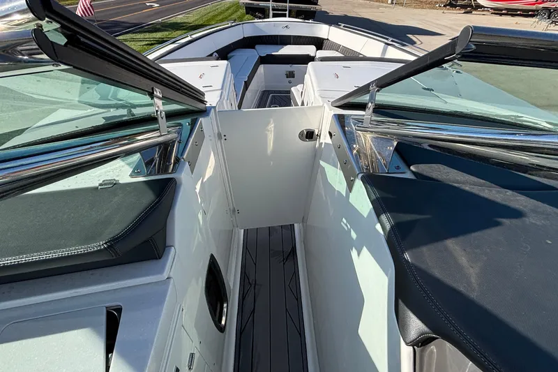 Slide: The Image of 2023 Monterey 385SS Super Sport boat interior with open windshield and seating area. - 19