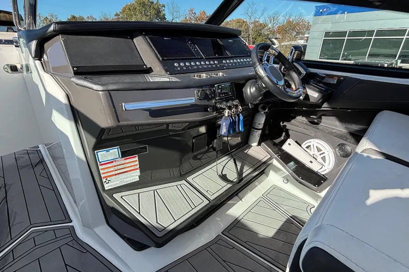 Slide: The Image of Interior cockpit of 2023 Monterey 385SS Super Sport boat with modern controls and steering. - 21