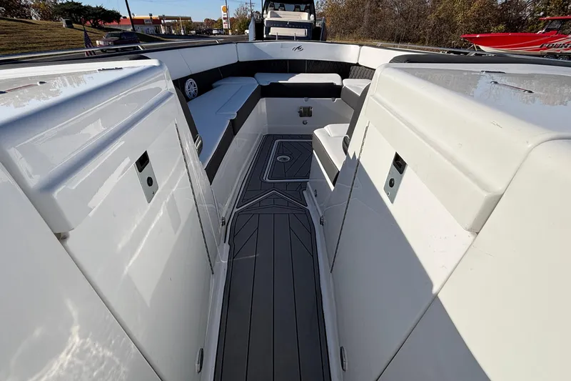 Slide: The Image of 2023 Monterey 385SS Super Sport boat interior with sleek seating and modern design. - 22