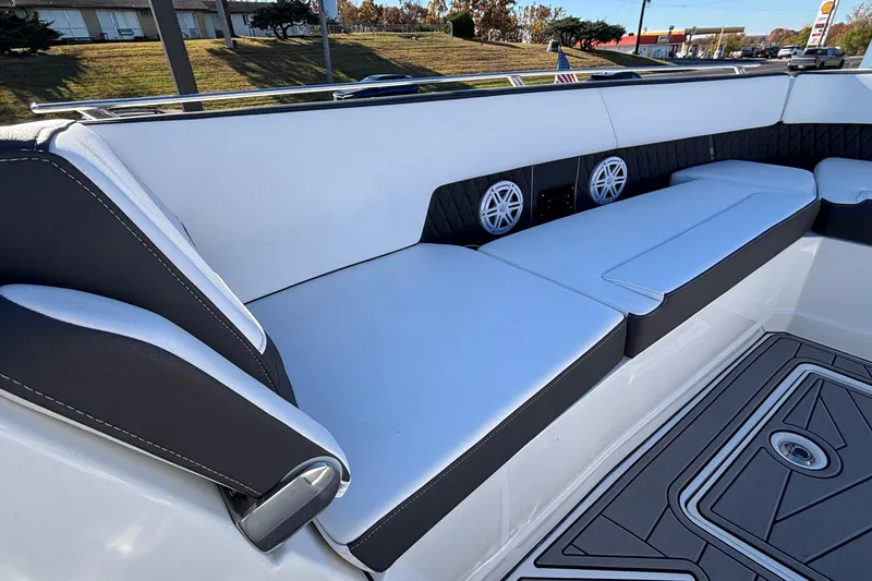 Slide: The Image of 2023 Monterey 385SS Super Sport boat interior with white seating and built-in speakers. - 23