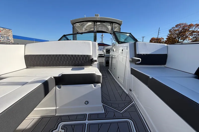 Slide: The Image of 2023 Monterey 385SS Super Sport boat interior with sleek seating and modern design. - 27