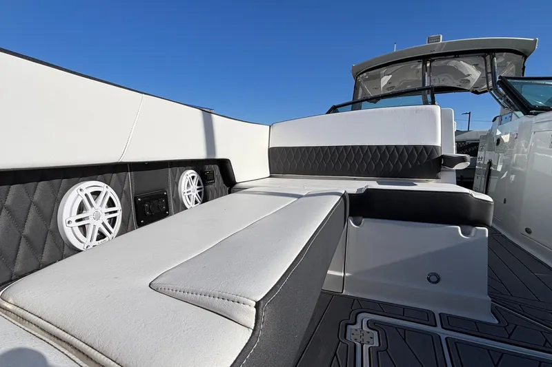 Slide: The Image of 2023 Monterey 385SS Super Sport boat interior with luxury seating and built-in speakers. - 28