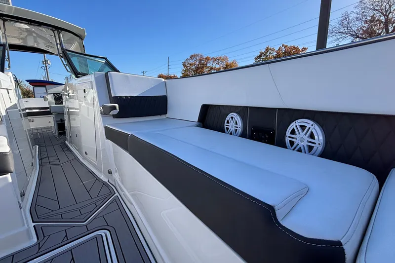 Slide: The Image of 2023 Monterey 385SS Super Sport boat interior with sleek seating and modern design. - 29