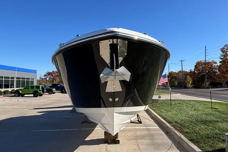 Slide: The Image of 2023 Monterey 385SS Super Sport boat displayed outdoors on a sunny day. - 3