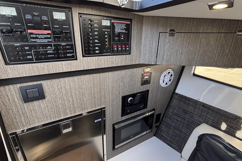 Slide: The Image of 2023 Monterey 385SS Super Sport interior with control panels and modern appliances. - 34