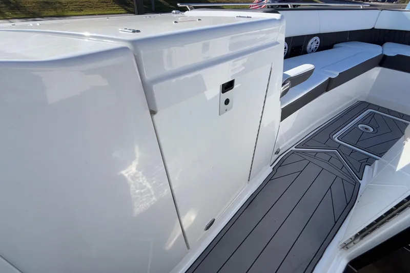 Slide: The Image of 2023 Monterey 385SS Super Sport boat interior with sleek seating and modern flooring. - 44