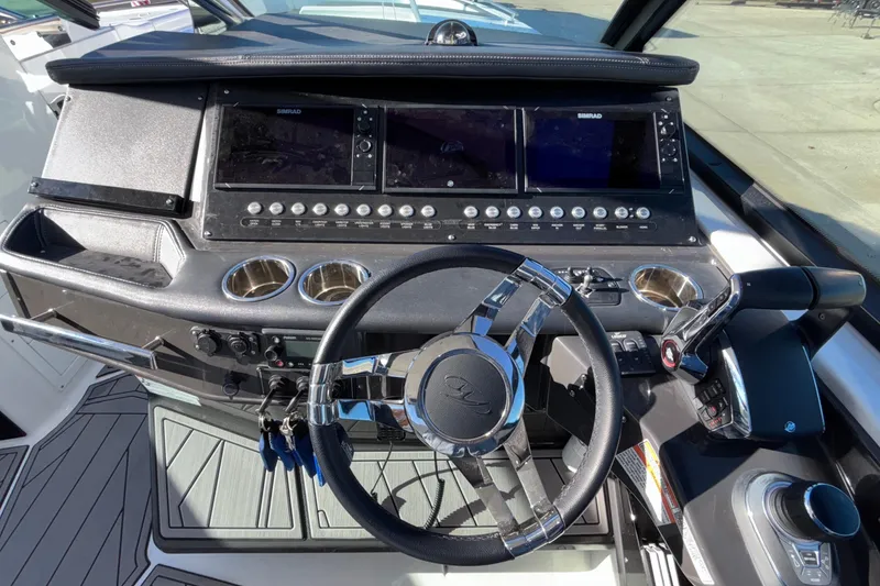 Slide: The Image of Cockpit of 2023 Monterey 385SS Super Sport boat with modern controls and steering wheel. - 45