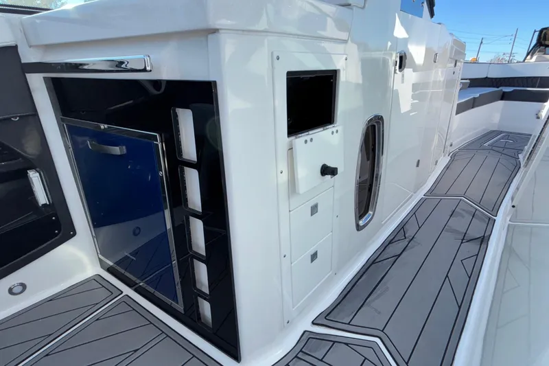 Slide: The Image of 2023 Monterey 385SS Super Sport boat interior with sleek design and modern amenities. - 49