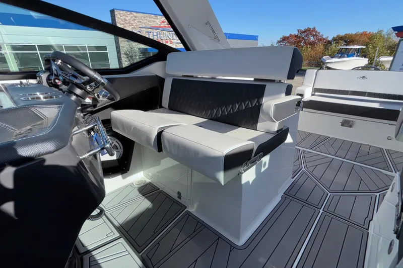 Slide: The Image of 2023 Monterey 385SS Super Sport boat interior with modern seating and steering wheel. - 54