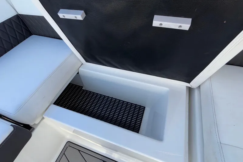 Slide: The Image of Open storage compartment in 2023 Monterey 385SS Super Sport boat interior. - 58