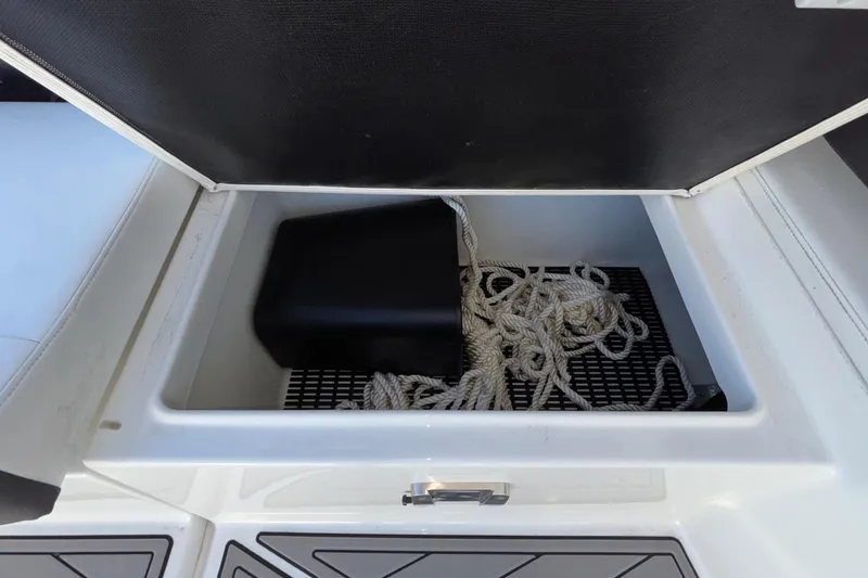 Slide: The Image of Storage compartment with rope in 2023 Monterey 385SS Super Sport boat. - 59
