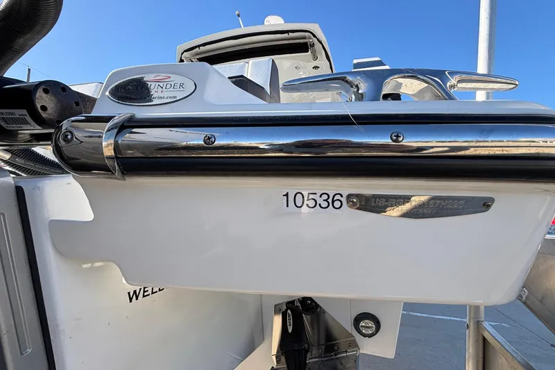 Slide: The Image of 2023 Monterey 385SS Super Sport boat stern with chrome details and identification numbers. - 68