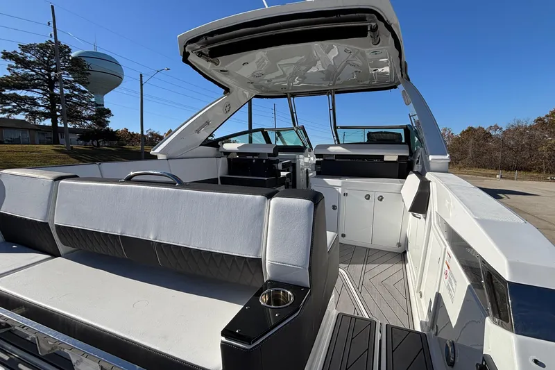 Slide: The Image of 2023 Monterey 385SS Super Sport boat interior with sleek seating and modern design. - 7