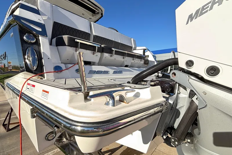 Slide: The Image of 2023 Monterey 385SS Super Sport boat rear view with engine and seating details. - 71