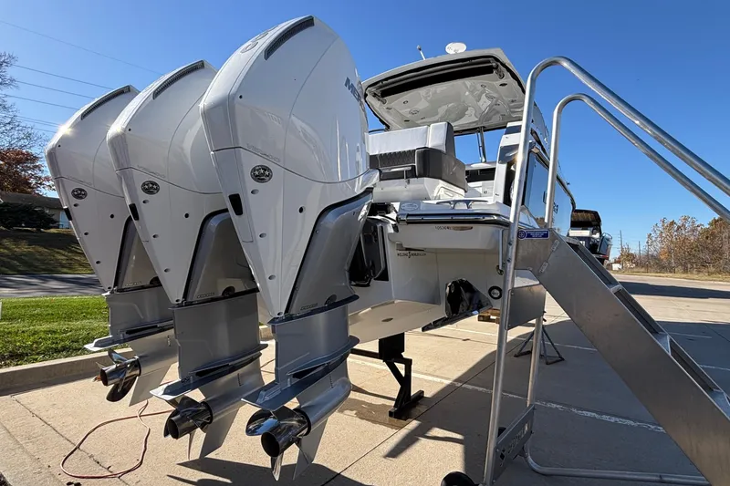 Slide: The Image of 2023 Monterey 385SS Super Sport boat with triple outboard engines on display. - 76