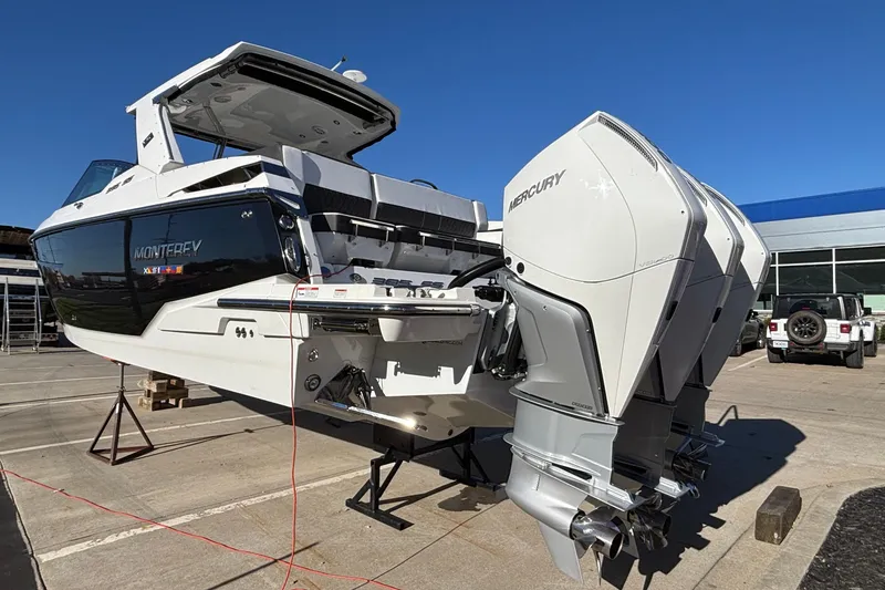 Slide: The Image of 2023 Monterey 385SS Super Sport boat with Mercury engines on display outdoors. - 78