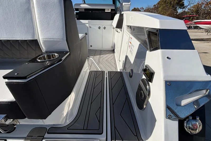 Slide: The Image of 2023 Monterey 385SS Super Sport boat interior with sleek seating and modern design elements. - 8