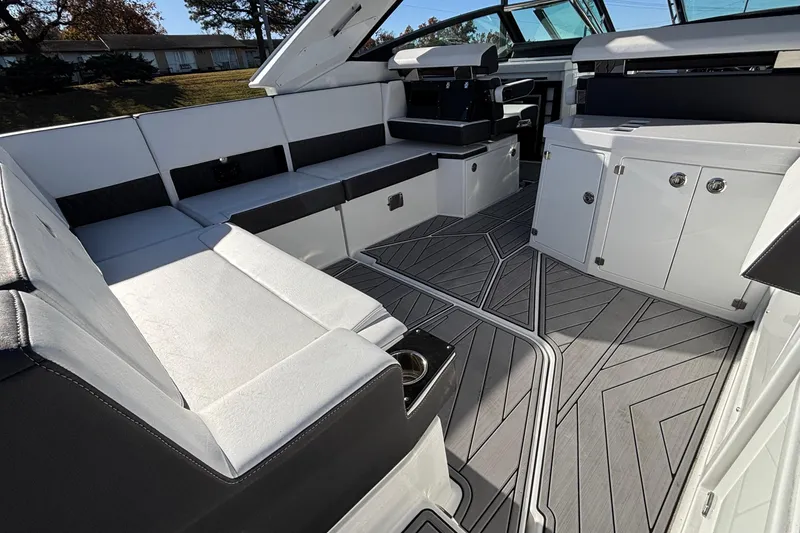 Slide: The Image of 2023 Monterey 385SS Super Sport boat interior with sleek seating and modern design. - 9