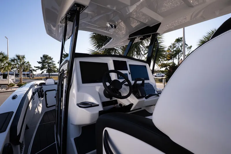 Slide: The Image of 2026 Sunsation 32 CCX boat cockpit with modern controls and sleek design. - 12