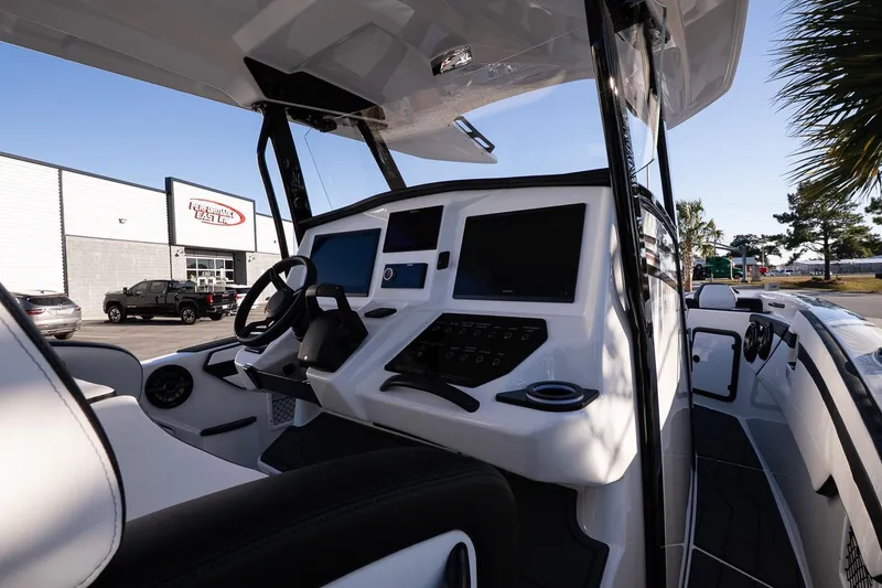 Slide: The Image of 2026 Sunsation 32 CCX boat cockpit with modern controls and sleek design. - 13