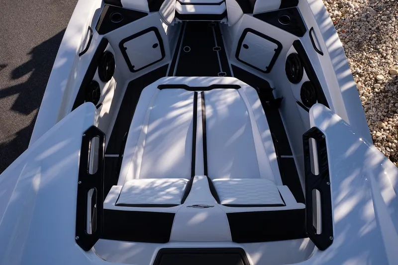 Slide: The Image of 2026 Sunsation 32 CCX boat interior with sleek white seating and modern design elements. - 21