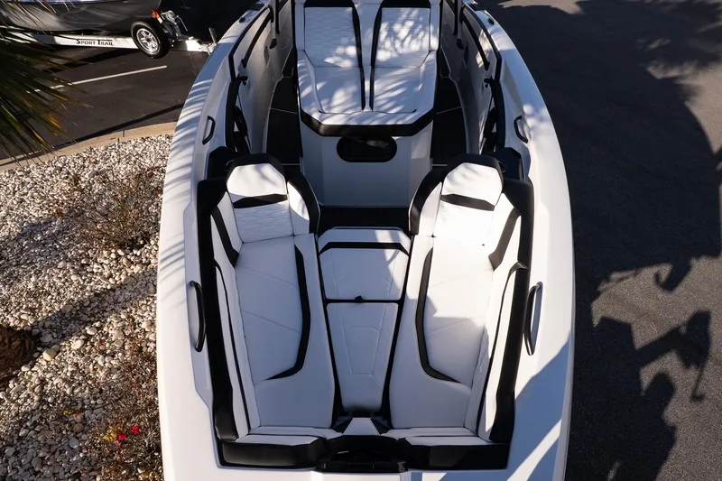 Slide: The Image of 2026 Sunsation 32 CCX boat interior with sleek white and black seating design. - 22