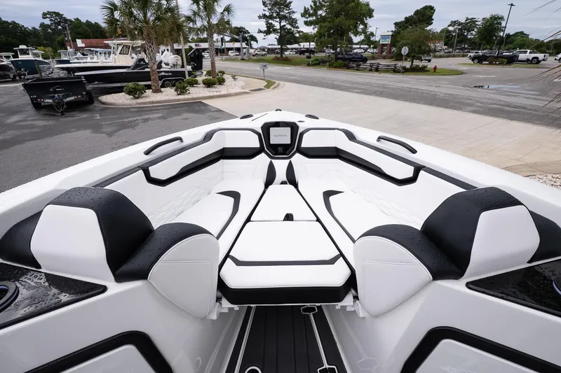 Slide: The Image of 2026 Sunsation 32 CCX boat interior with sleek white and black seating design. - 35