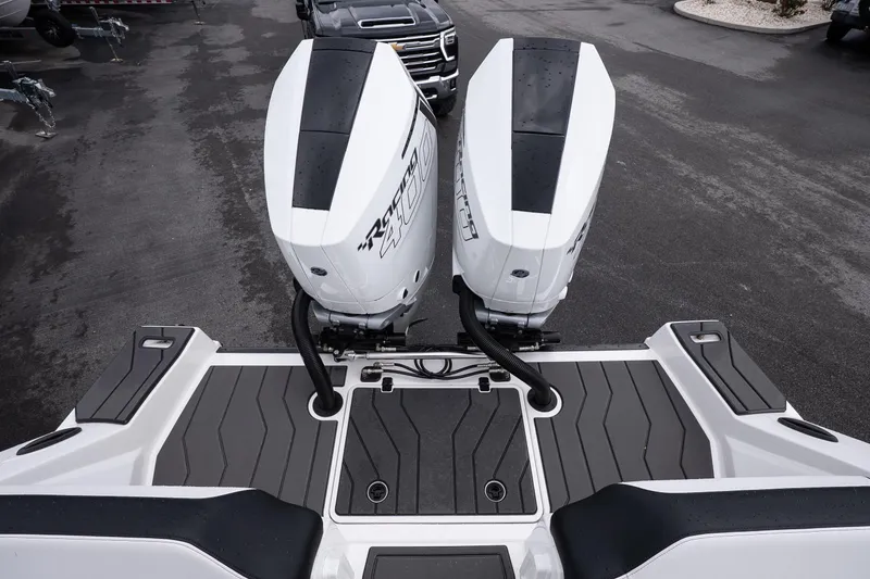 Slide: The Image of 2026 Sunsation 32 CCX boat with dual outboard engines, rear deck view. - 40