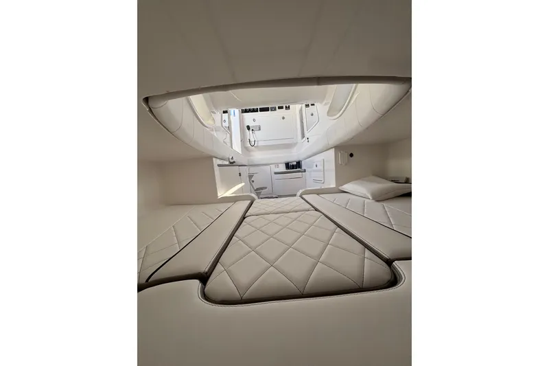 Slide: The Image of 2026 Deep Impact 399 Sport boat dashboard with modern navigation and control systems. - 15