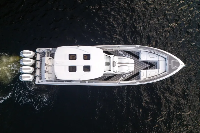 Slide: The Image of Interior of 2026 Deep Impact 399 Sport boat with modern dashboard and steering wheel. - 16