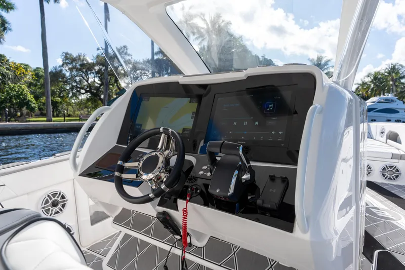 Slide: The Image of 2026 Deep Impact 399 Sport boat interior with sleek white design and modern flooring. - 21