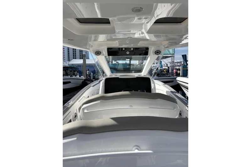 Slide: The Image of Aerial view of 2026 Deep Impact 399 Sport boat cruising on water. - 3