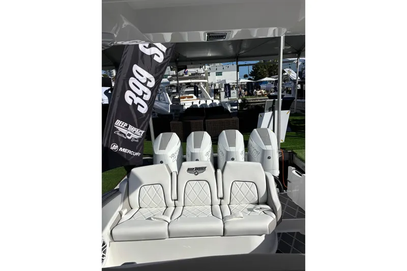 Slide: The Image of 2026 Deep Impact 399 Sport boat cruising on a sunny waterway. - 4
