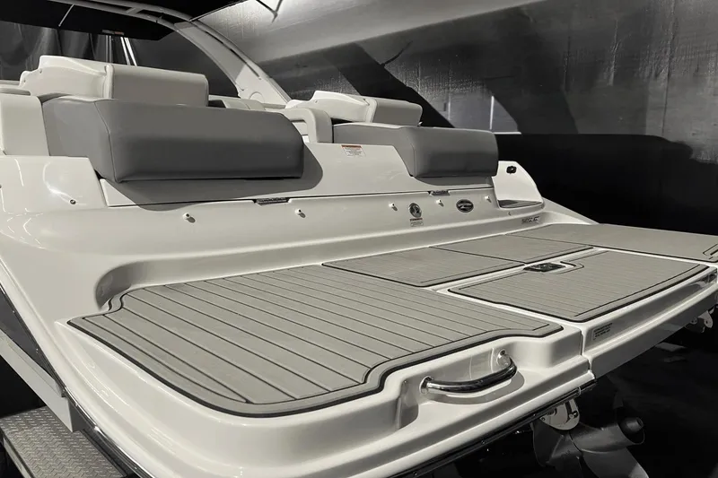 Slide: The Image of 2024 Sea Ray SDX 290 boat with spacious rear deck and cushioned seating. - 12