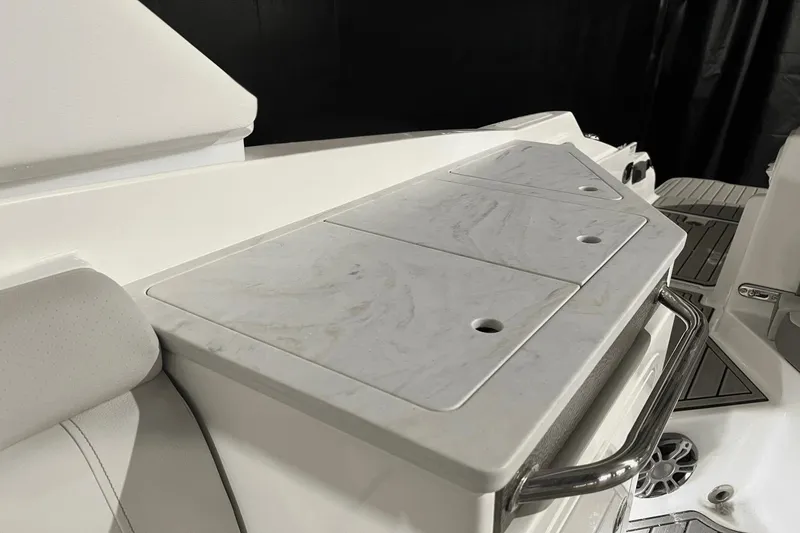 Slide: The Image of 2024 Sea Ray SDX 290 boat interior with sleek white seating and modern design features. - 13