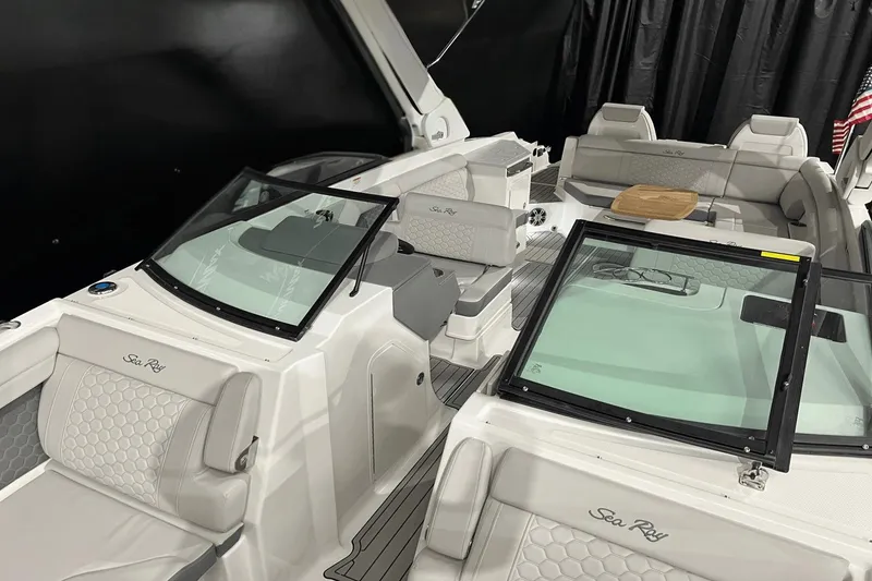 Slide: The Image of 2024 Sea Ray SDX 290 boat interior with luxurious seating and modern design. - 16