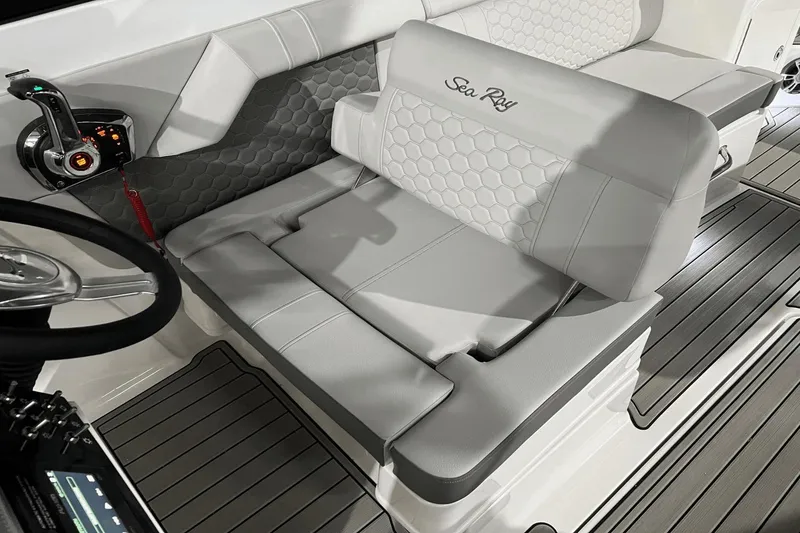 Slide: The Image of 2024 Sea Ray SDX 290 boat interior with luxurious seating and modern controls. - 18