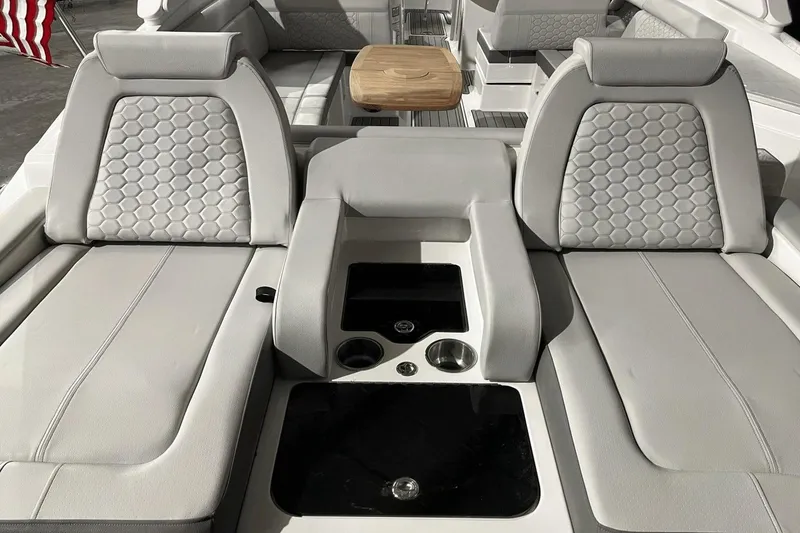 Slide: The Image of 2024 Sea Ray SDX 290 boat interior with luxurious seating and modern design. - 25