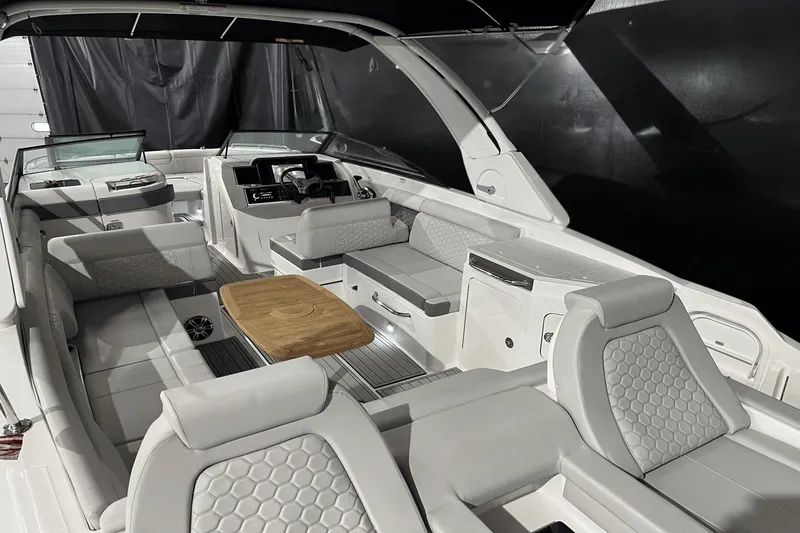 Slide: The Image of 2024 Sea Ray SDX 290 boat interior with luxurious seating and modern design. - 26